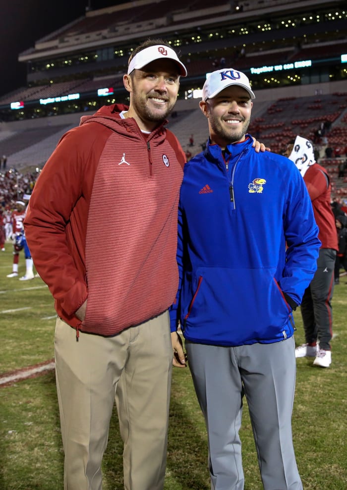 Garrett Riley (right) poses for a photo with Lincoln Riley (left) during his time as an offensive analyst at Kansas.